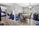 Bright dining area with modern flooring and a view into the bedroom at 101 Olympic Ct, Fayetteville, GA 30214