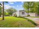 Exterior of a well-maintained home with a tidy lawn, mature trees and an ample driveway at 101 Olympic Ct, Fayetteville, GA 30214