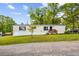 Single story home with a well-manicured lawn, and a small front deck at 101 Olympic Ct, Fayetteville, GA 30214