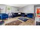 The cozy living room features sleek flooring, grey walls, and ample natural light at 101 Olympic Ct, Fayetteville, GA 30214