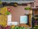 Aerial view of the back deck with a hot tub, grill, outdoor seating, and surrounding greenery at 287 West Wind Dr, Lilburn, GA 30047