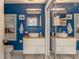 Stylish bathroom with dual vessel sinks, blue walls, and modern fixtures at 287 West Wind Dr, Lilburn, GA 30047