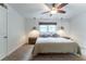 Spacious bedroom with a ceiling fan, natural light, and cozy carpet at 287 West Wind Dr, Lilburn, GA 30047
