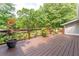 Outdoor deck overlooking a picturesque backyard landscape at 287 West Wind Dr, Lilburn, GA 30047