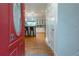 View from the entryway showcasing an open-concept design that leads into the bright kitchen with modern finishes at 287 West Wind Dr, Lilburn, GA 30047