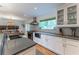 A view of the modern kitchen, with an island, stainless steel appliances, and ample counter space at 287 West Wind Dr, Lilburn, GA 30047