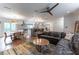 Comfortable living room that flows to the open kitchen and dining area, with abundant natural light at 287 West Wind Dr, Lilburn, GA 30047