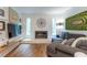 Comfortable living room with a fireplace, large TV, and cozy seating at 287 West Wind Dr, Lilburn, GA 30047