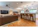 Spacious open-concept living room and kitchen featuring a large sofa, breakfast bar, and contemporary lighting at 287 West Wind Dr, Lilburn, GA 30047
