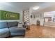 Spacious living room with a fireplace, a dining area, and comfortable seating at 287 West Wind Dr, Lilburn, GA 30047