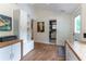 A view of a finished home office with custom cabinets and access to a full bathroom at 287 West Wind Dr, Lilburn, GA 30047