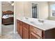 Dual sinks and a doorway into the bedroom elevate this bathroom at 4181 Integrity Way, Powder Springs, GA 30127