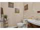 Cozy half bathroom featuring decorative wall art, a pedestal sink, and updated fixtures at 4181 Integrity Way, Powder Springs, GA 30127