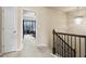 Upstairs hallway with a chandelier and bedroom visible through doorway at 4181 Integrity Way, Powder Springs, GA 30127