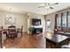 Open living area with hardwood floors, a modern light fixture, and access to the outdoor patio at 4181 Integrity Way, Powder Springs, GA 30127
