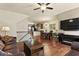 Inviting living space featuring hardwood floors, a cozy seating area, and an adjacent dining space at 4181 Integrity Way, Powder Springs, GA 30127