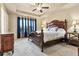 Spacious main bedroom with a decorative tray ceiling, a ceiling fan and lots of natural light at 4181 Integrity Way, Powder Springs, GA 30127