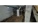 Utility room in the basement, featuring concrete walls, mechanical equipment, and a concrete floor at 1516 Carter Rd, Decatur, GA 30032