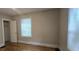 Bright bedroom with a window and trim with neutral walls and a closet at 1516 Carter Rd, Decatur, GA 30032