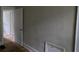 Neutral-toned bedroom featuring hardwood floors, showcasing the doorway and natural light at 1516 Carter Rd, Decatur, GA 30032