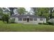 Traditional single-story home with a symmetrical facade, black shutters, and a well-maintained lawn at 1516 Carter Rd, Decatur, GA 30032