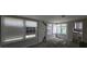 Sun room filled with natural light through many windows, leading to the kitchen at 1516 Carter Rd, Decatur, GA 30032