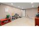 Spacious basement with tile flooring, recessed lighting, and room for recreation at 1582 E Bank Dr, Marietta, GA 30068