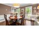 Bright dining room featuring hardwood floors, a chandelier, and large windows at 1582 E Bank Dr, Marietta, GA 30068