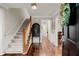 Inviting foyer with gleaming hardwood floors, staircase, and stylish decor at 1582 E Bank Dr, Marietta, GA 30068
