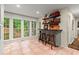 This kitchen has a breakfast bar with wooden stools, stainless steel appliances and a tile floor at 1582 E Bank Dr, Marietta, GA 30068