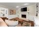 Comfortable living room with hardwood floors, a fireplace, and natural light at 1582 E Bank Dr, Marietta, GA 30068