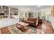 Bright and airy living room with built-in bookshelves, hardwood floors, and stylish furnishings at 1582 E Bank Dr, Marietta, GA 30068