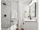 Modern bathroom features a tile shower, updated vanity, and modern fixtures at 2011 W Starmount Way, Decatur, GA 30032