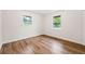 Empty bedroom featuring hardwood floors, natural light, and a clean, bright space at 2011 W Starmount Way, Decatur, GA 30032