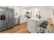 Bright kitchen with stainless steel appliances, white cabinets, island with bar seating at 2011 W Starmount Way, Decatur, GA 30032