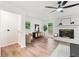 Bright living room featuring hardwood floors, fireplace, and modern furnishings at 2011 W Starmount Way, Decatur, GA 30032