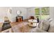Cozy living room featuring neutral tones, a large window, and comfortable seating area at 2011 W Starmount Way, Decatur, GA 30032