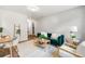 Bright living room featuring painted brick wall, a comfortable sofa, and wood accents at 2011 W Starmount Way, Decatur, GA 30032