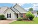 Charming single-story home with brick and siding, featuring a well-manicured lawn and inviting curb appeal at 220 Turnstone Rd, Stockbridge, GA 30281