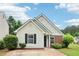 Charming single-story home with brick and siding, featuring a well-manicured lawn and inviting curb appeal at 220 Turnstone Rd, Stockbridge, GA 30281
