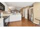 Bright and modern eat-in kitchen with white cabinets, stainless steel appliances, and stylish backsplash at 220 Turnstone Rd, Stockbridge, GA 30281