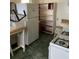 Outdated kitchen features white appliances and linoleum flooring at 2689 Knox Ne St, Atlanta, GA 30317