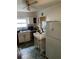 A kitchen featuring white cabinets, appliances, and a table in the center at 2689 Knox Ne St, Atlanta, GA 30317