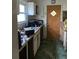 Outdated kitchen with linoleum flooring and white cabinetry at 2689 Knox Ne St, Atlanta, GA 30317