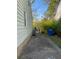 Side yard features a concrete path, foliage, and a green exterior at 2689 Knox Ne St, Atlanta, GA 30317