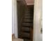 A narrow staircase with gray steps and a wooden handrail at 2689 Knox Ne St, Atlanta, GA 30317