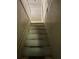 A staircase with white risers and a wooden handrail leading upwards at 2689 Knox Ne St, Atlanta, GA 30317