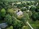 Overhead perspective of a home nestled amidst lush greenery, showcasing its secluded and peaceful setting at 2944 Berry Rd, Loganville, GA 30052