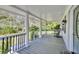 Charming covered porch featuring classic columns and outdoor seating, perfect for relaxation at 2944 Berry Rd, Loganville, GA 30052