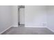 Bedroom features new carpet, fresh paint, and doors leading to other areas of the home at 5795 Deerfield Trl, Atlanta, GA 30349